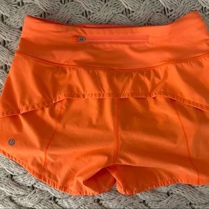 Lululemon orange speed up shorts. Size 4. 4 inch.